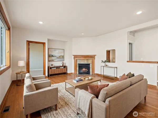 a living room with furniture and a fireplace