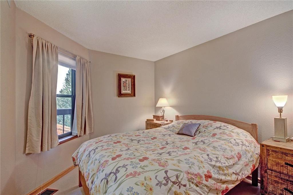 570 Bills Ranch Road, Unit 235 Frisco, CO 80443 - Photo 14 of 25 a bedroom with a bed and a window