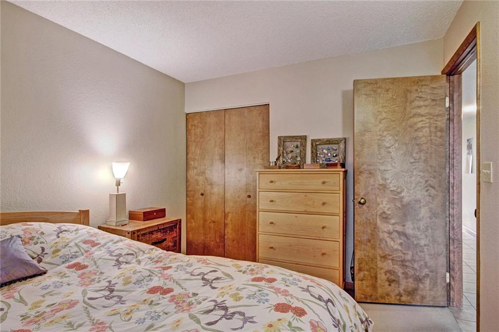 570 Bills Ranch Road, Unit 235 Frisco, CO 80443 - Photo 15 of 25 a bedroom with a bed and a dresser
