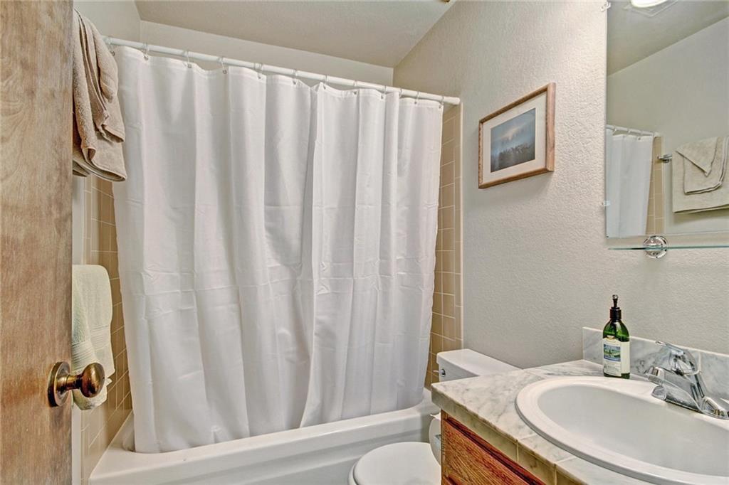 570 Bills Ranch Road, Unit 235 Frisco, CO 80443 - Photo 16 of 25 a bathroom with a granite countertop sink and a mirror