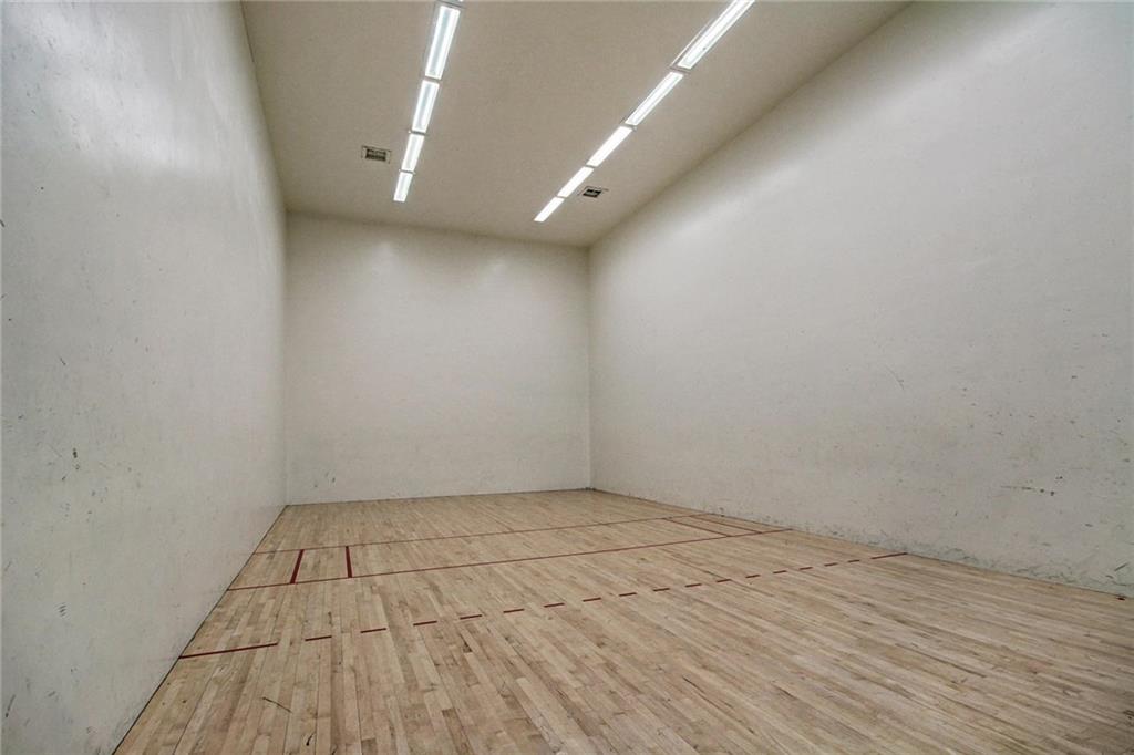 570 Bills Ranch Road, Unit 235 Frisco, CO 80443 - Photo 23 of 25 an empty room with wooden floor and windows