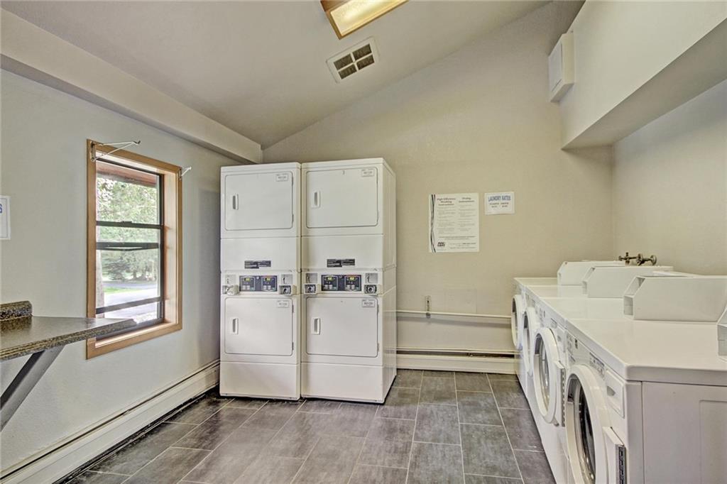 570 Bills Ranch Road, Unit 235 Frisco, CO 80443 - Photo 25 of 25 a utility room with cabinets washer and dryer