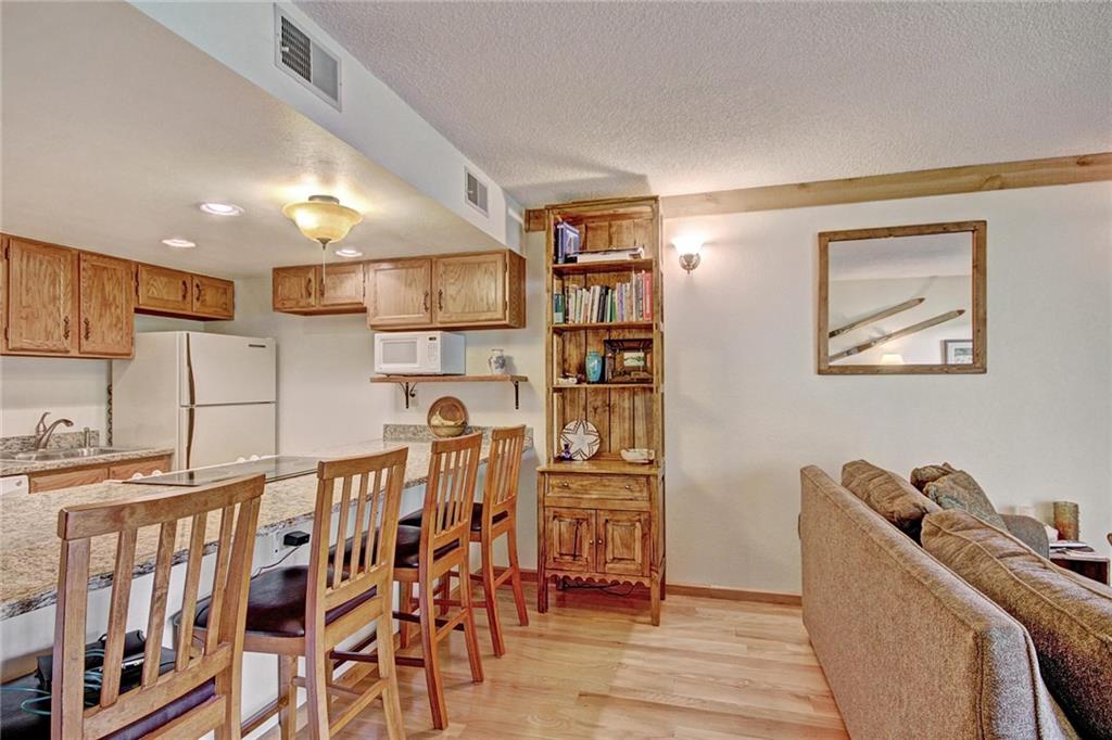570 Bills Ranch Road, Unit 235 Frisco, CO 80443 - Photo 9 of 25 a room with furniture a air conditioner vent and a window