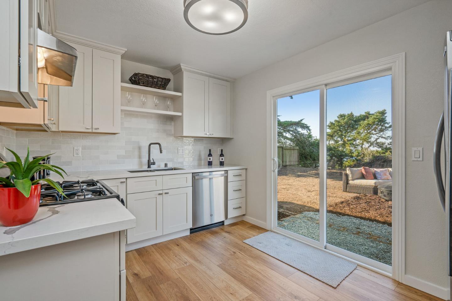 390 Heathcliff Drive Pacifica, CA 94044 - Photo 14 of 43 a kitchen with a sink stove and cabinets