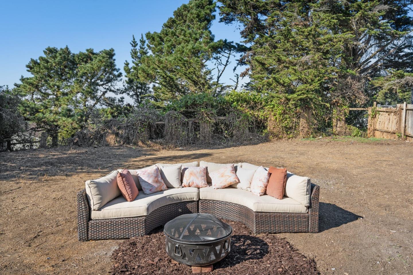 390 Heathcliff Drive Pacifica, CA 94044 - Photo 20 of 43 a roof deck with couches and wooden fence
