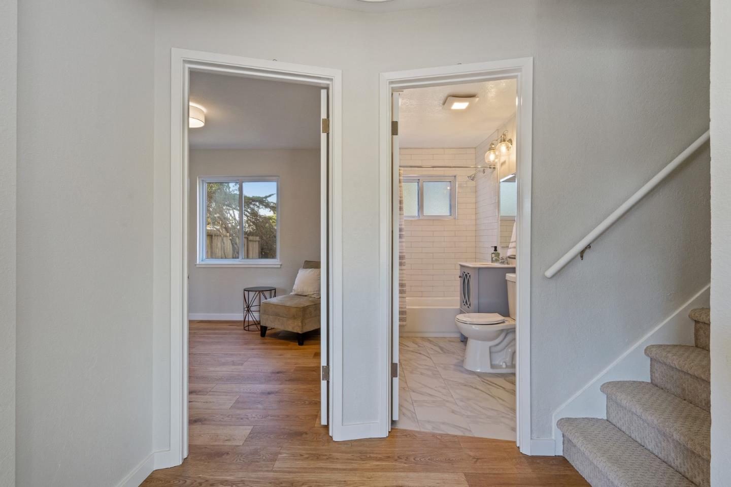 390 Heathcliff Drive Pacifica, CA 94044 - Photo 22 of 43 a view of a room with wooden floor and a bathroom
