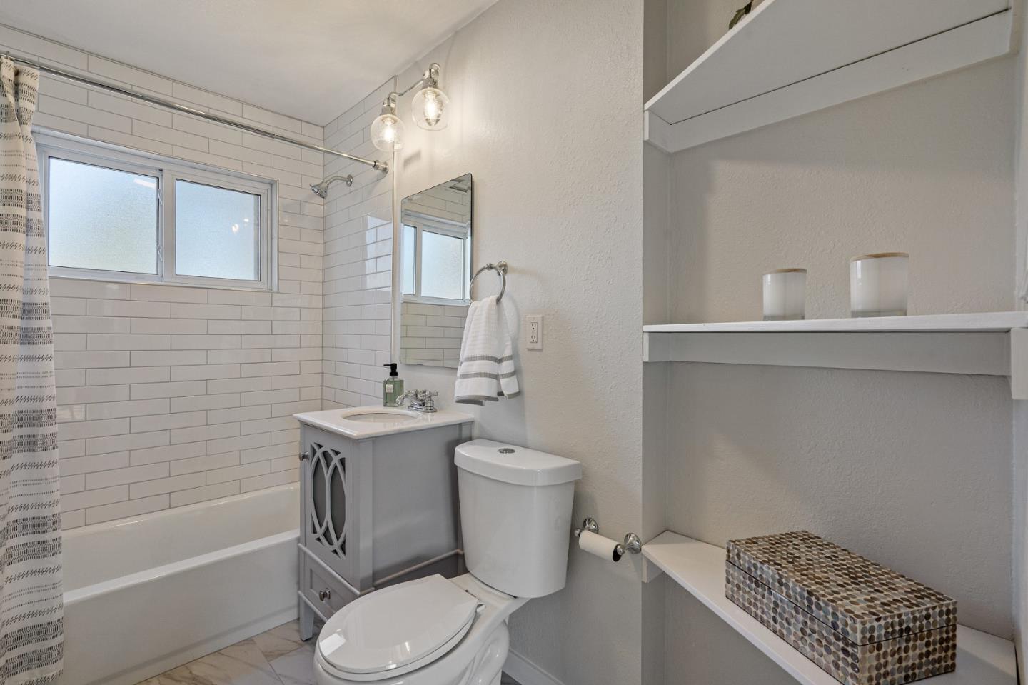 390 Heathcliff Drive Pacifica, CA 94044 - Photo 25 of 43 a bathroom with a sink a toilet and shower
