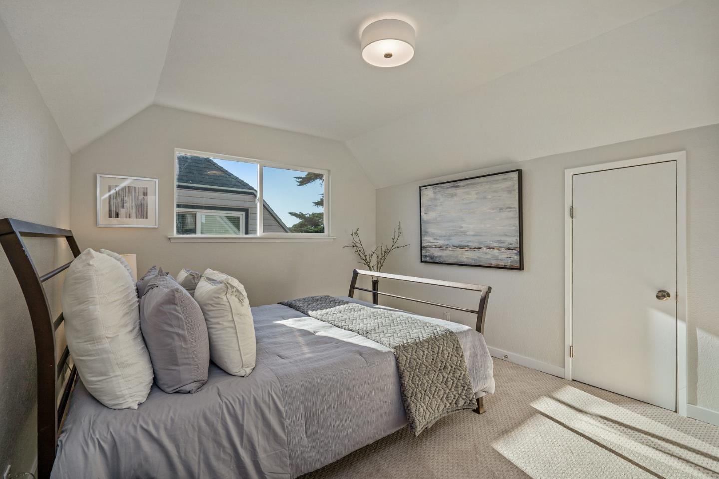 390 Heathcliff Drive Pacifica, CA 94044 - Photo 29 of 43 a bedroom with a bed and wooden floor