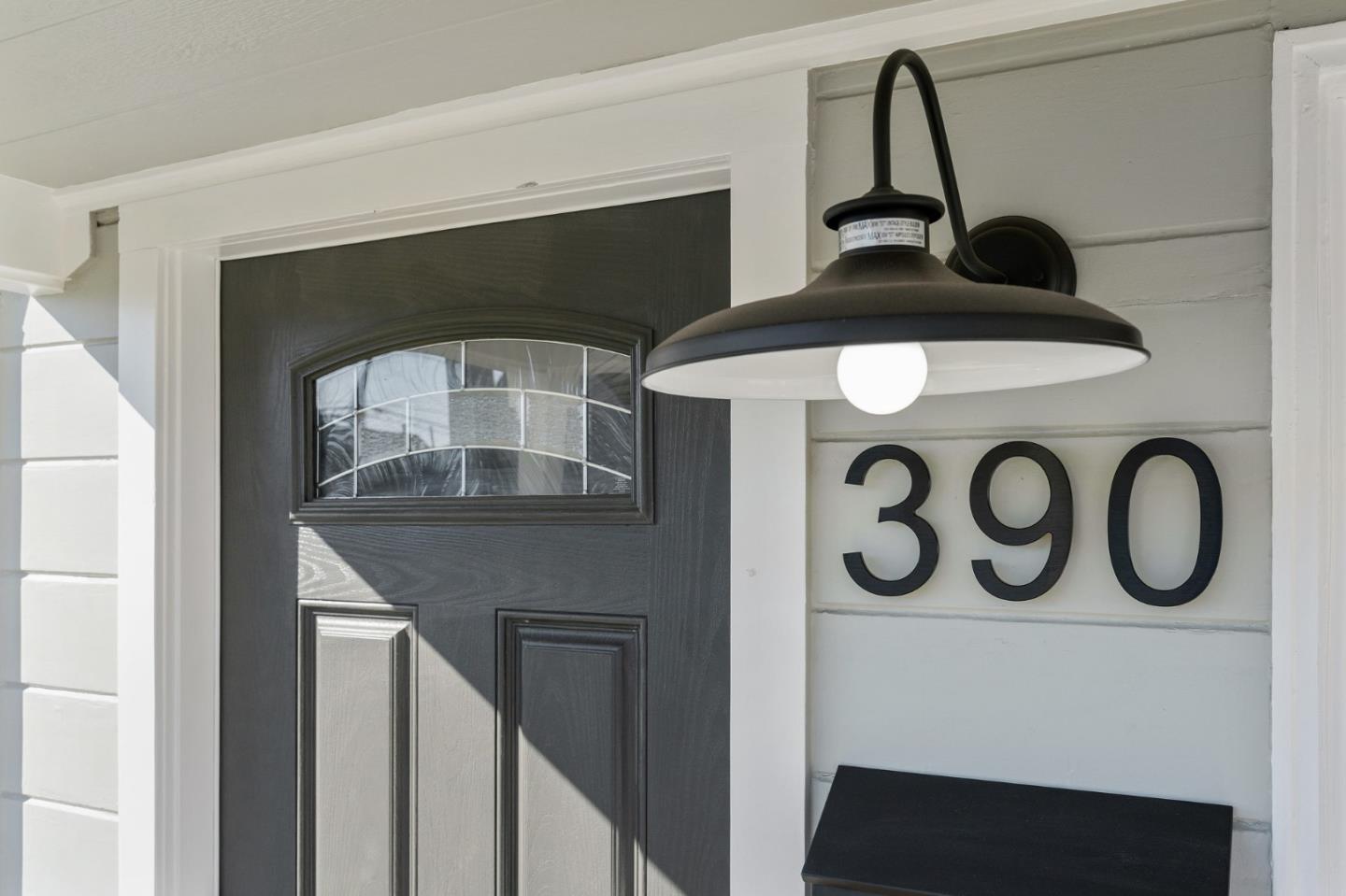 390 Heathcliff Drive Pacifica, CA 94044 - Photo 3 of 43 a front view of a house with a door and a mirror