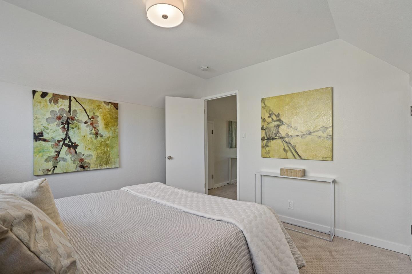 390 Heathcliff Drive Pacifica, CA 94044 - Photo 34 of 43 a bedroom with a bed and a window