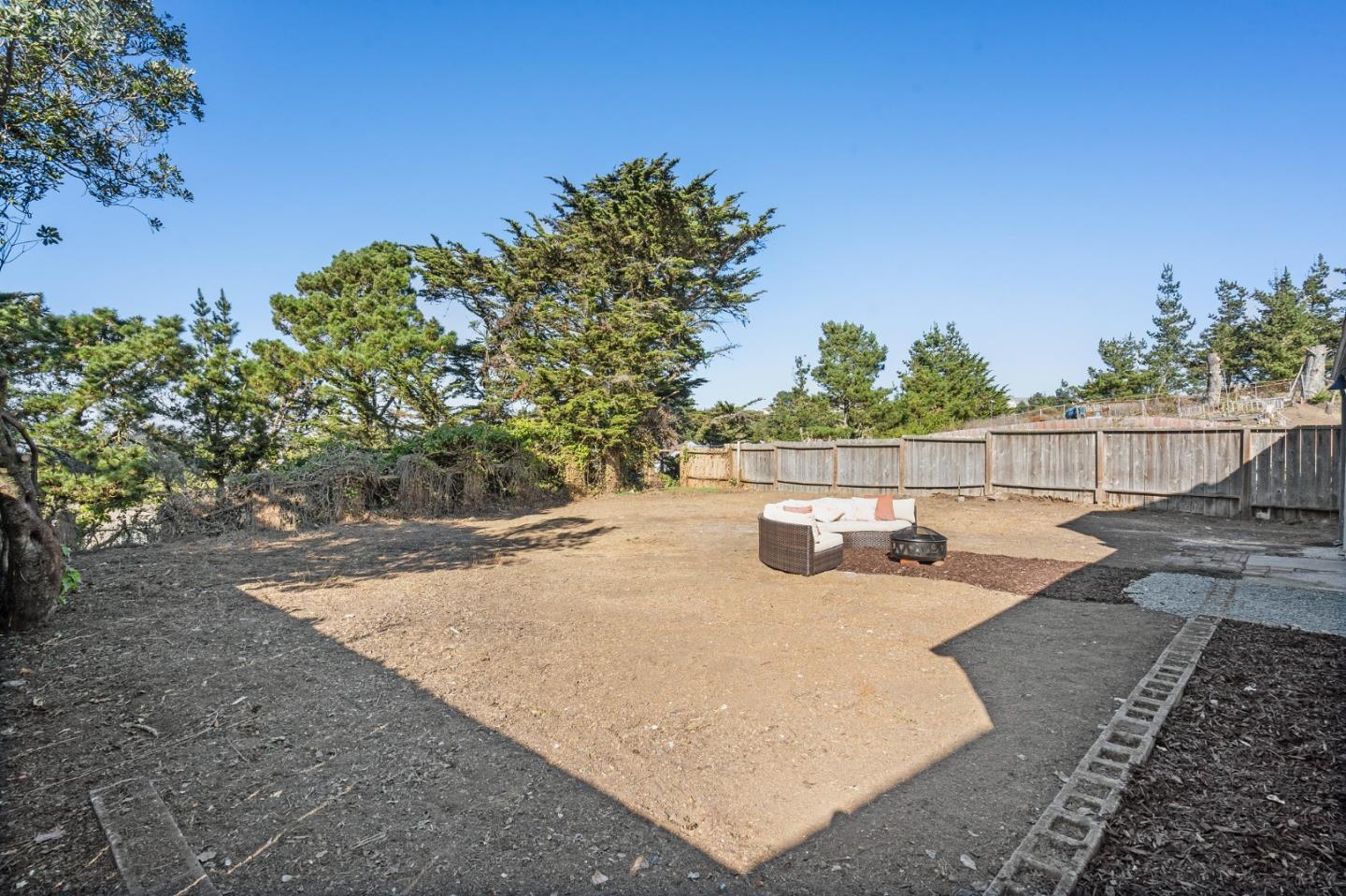 390 Heathcliff Drive Pacifica, CA 94044 - Photo 40 of 43 a view of a backyard with sitting area
