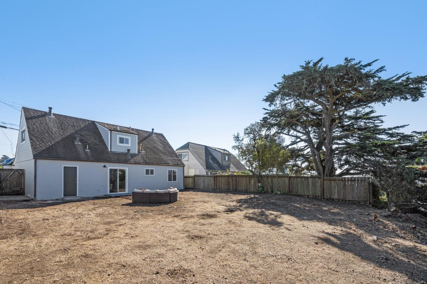 390 Heathcliff Drive Pacifica, CA 94044 - Photo 42 of 43 a front view of a house with a yard and garage