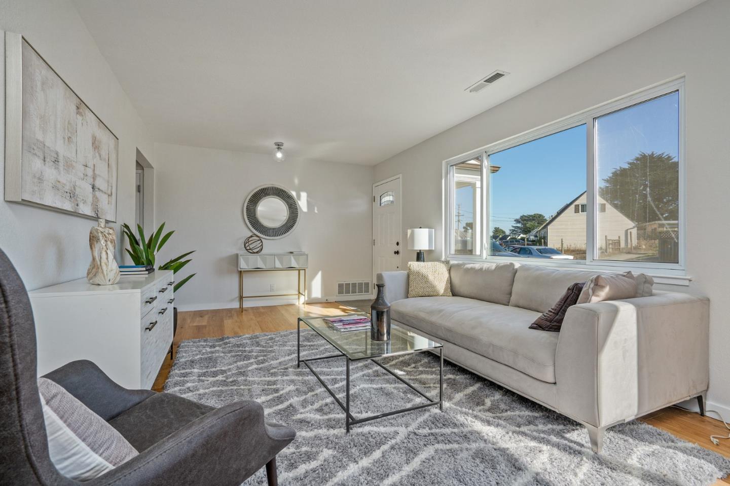 390 Heathcliff Drive Pacifica, CA 94044 - Photo 8 of 43 a living room with furniture a window and a potted plant