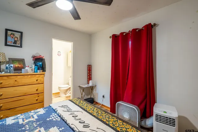 a view of a bedroom with furniture and staircase