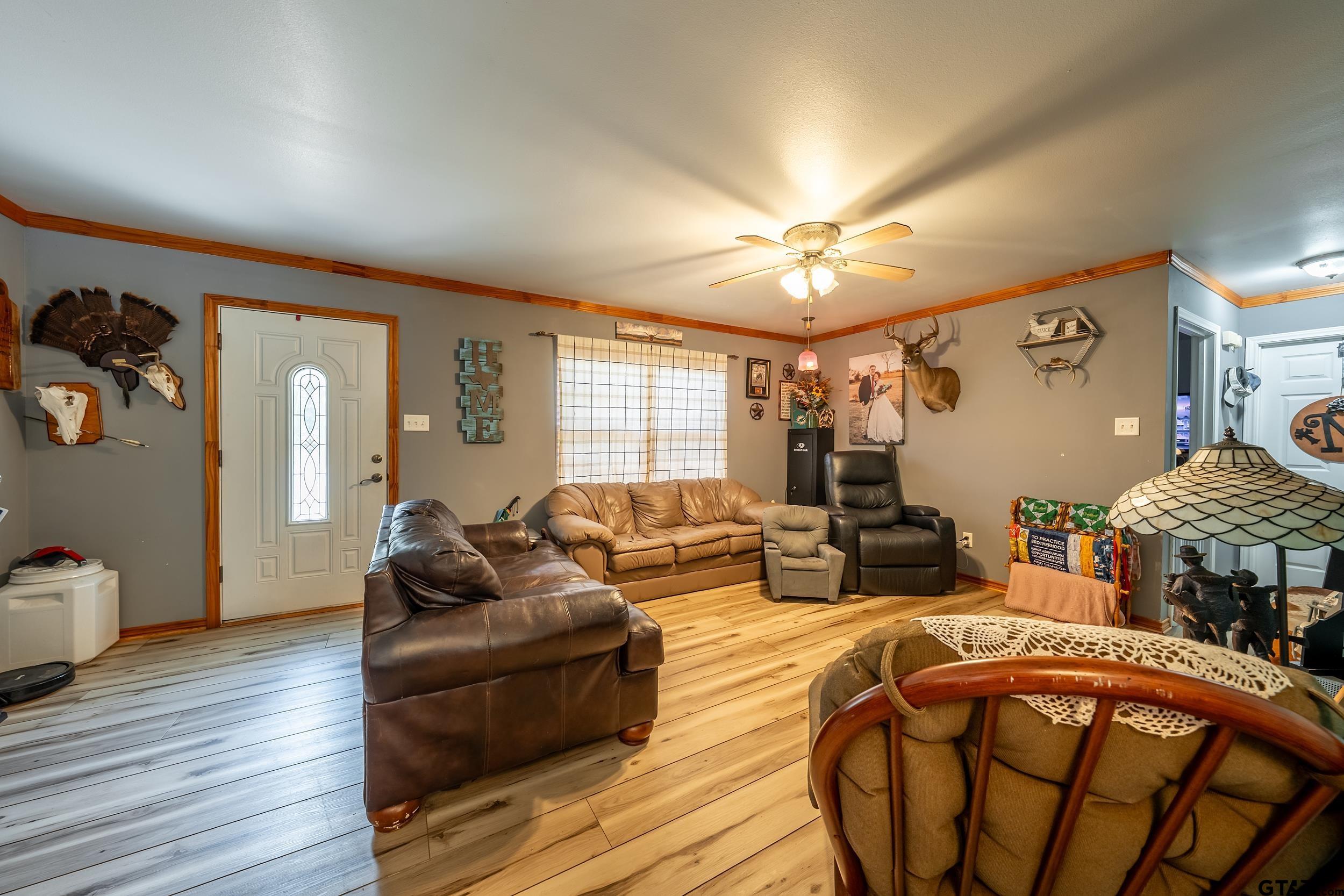 258 West 6th Street Rusk, TX 75785 - Photo 19 of 22 a living room with furniture a couch and wooden floor