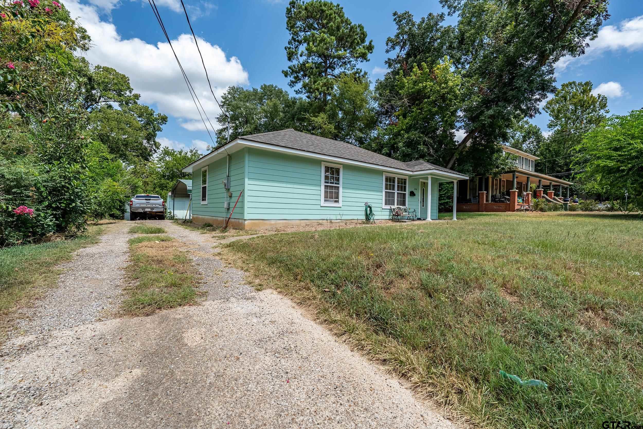 258 West 6th Street Rusk, TX 75785 - Photo 3 of 22 a front view of house with yard and trees around
