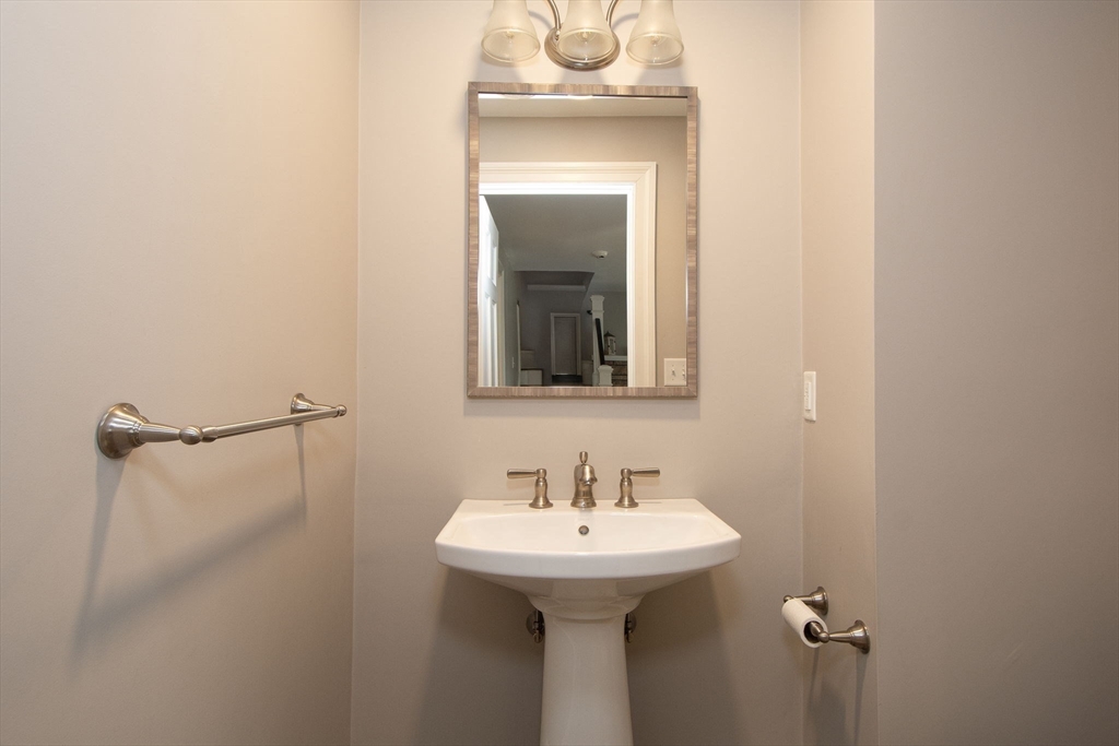 474 King Street, Unit 474 Cohasset, MA 02025 - Photo 15 of 18 a bathroom with a sink and a mirror