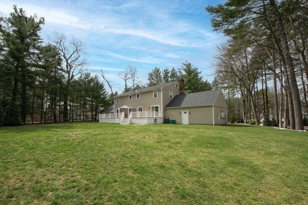 474 King Street, Unit 474 Cohasset, MA 02025 - Photo 17 of 18 front view of a house with a big yard