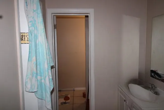 a bathroom with a sink and toilet