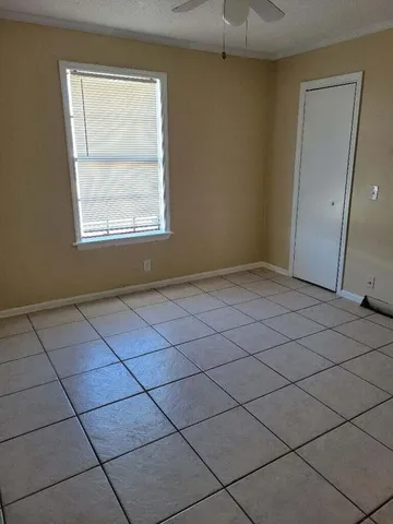 a view of an empty room and a window