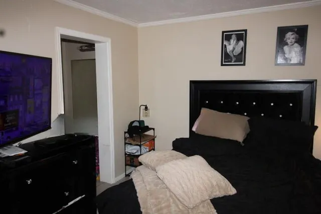 a living room with furniture a rug and a lamp