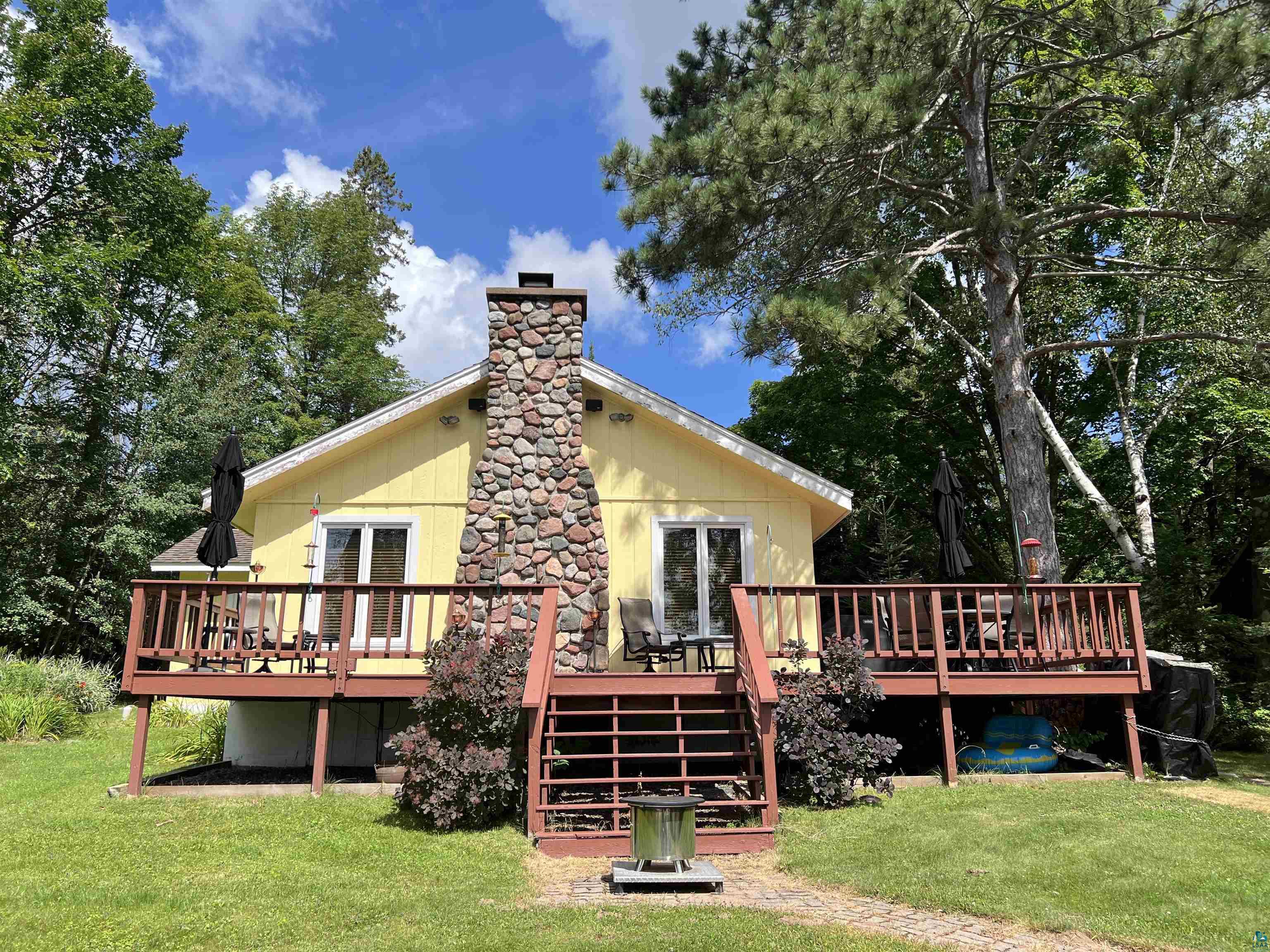 46835 Behan Drive Cable, WI 54821 - Photo 1 of 42 Back of property with a deck and a lawn