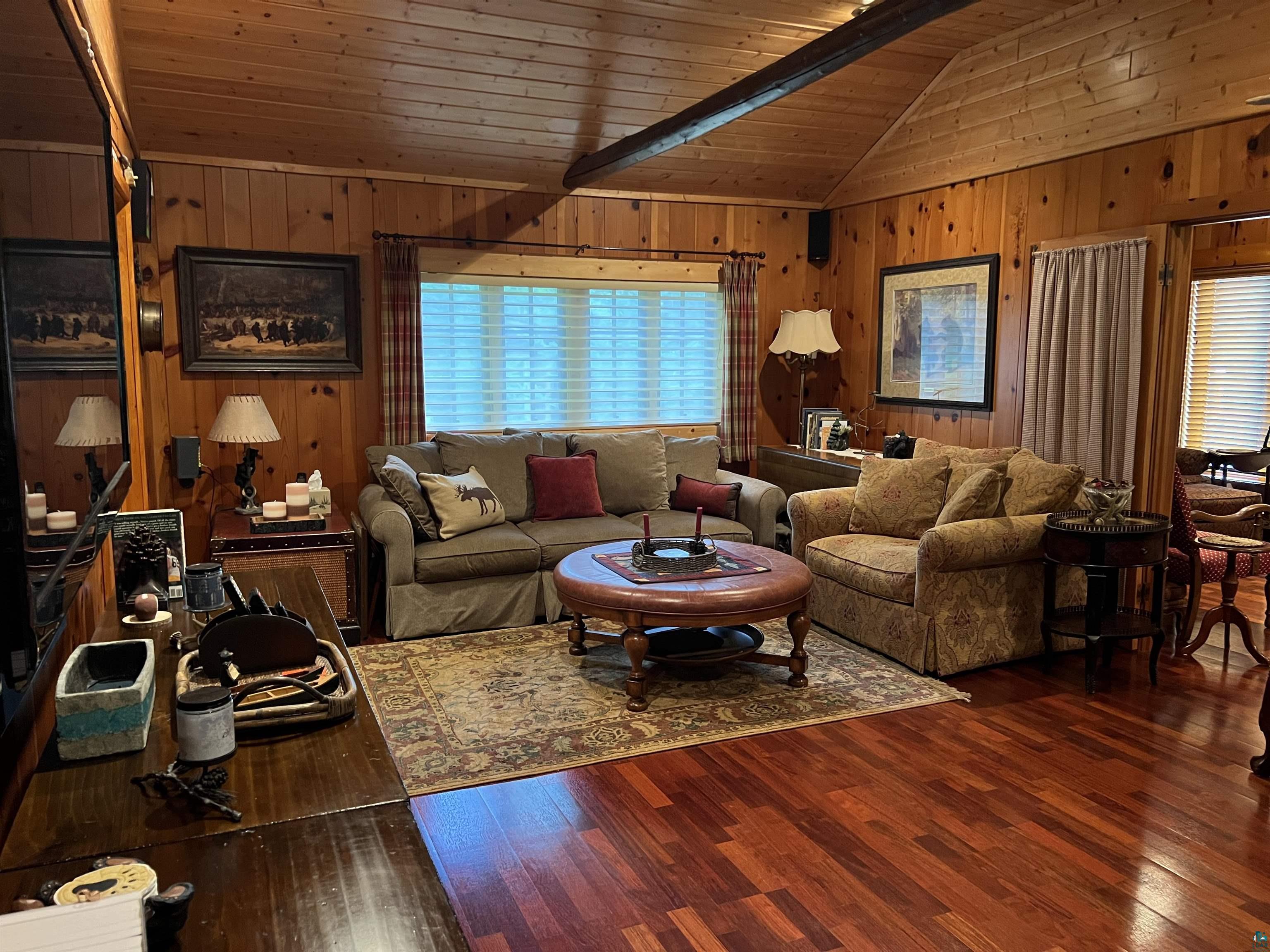 46835 Behan Drive Cable, WI 54821 - Photo 11 of 42 Living room with wood walls, dark wood-type flooring, and wood ceiling
