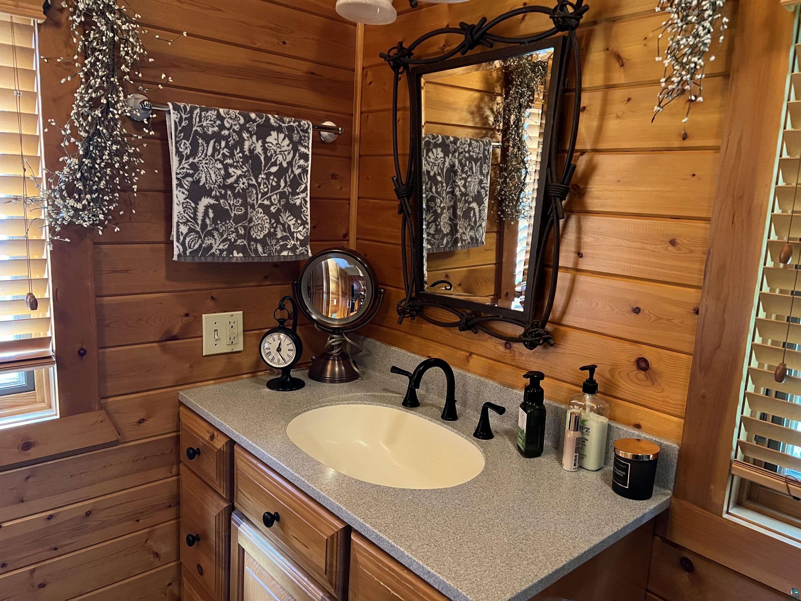 46835 Behan Drive Cable, WI 54821 - Photo 15 of 42 Bathroom featuring vanity and wood walls