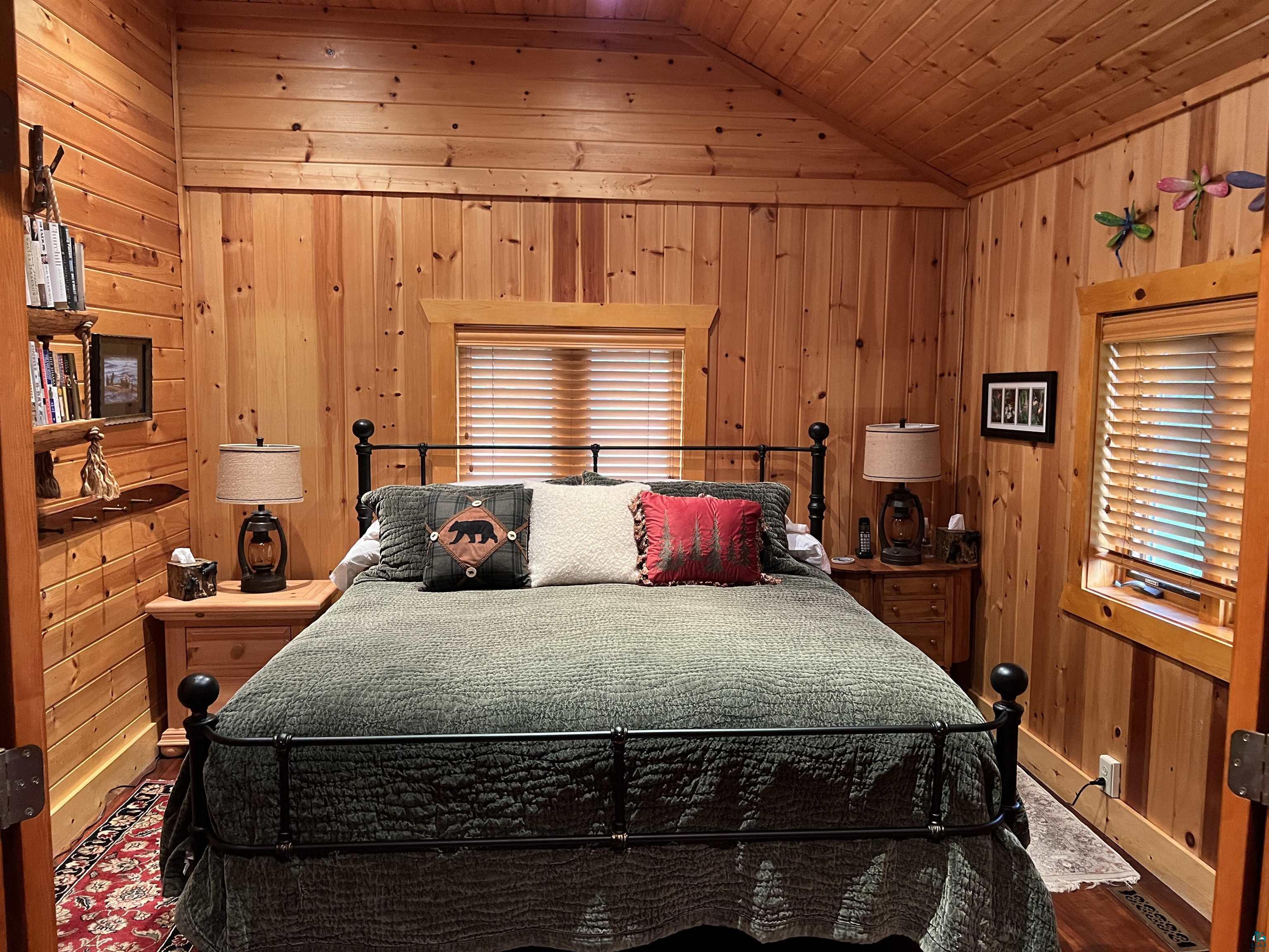 46835 Behan Drive Cable, WI 54821 - Photo 17 of 42 Bedroom with lofted ceiling, wooden walls, and wooden ceiling