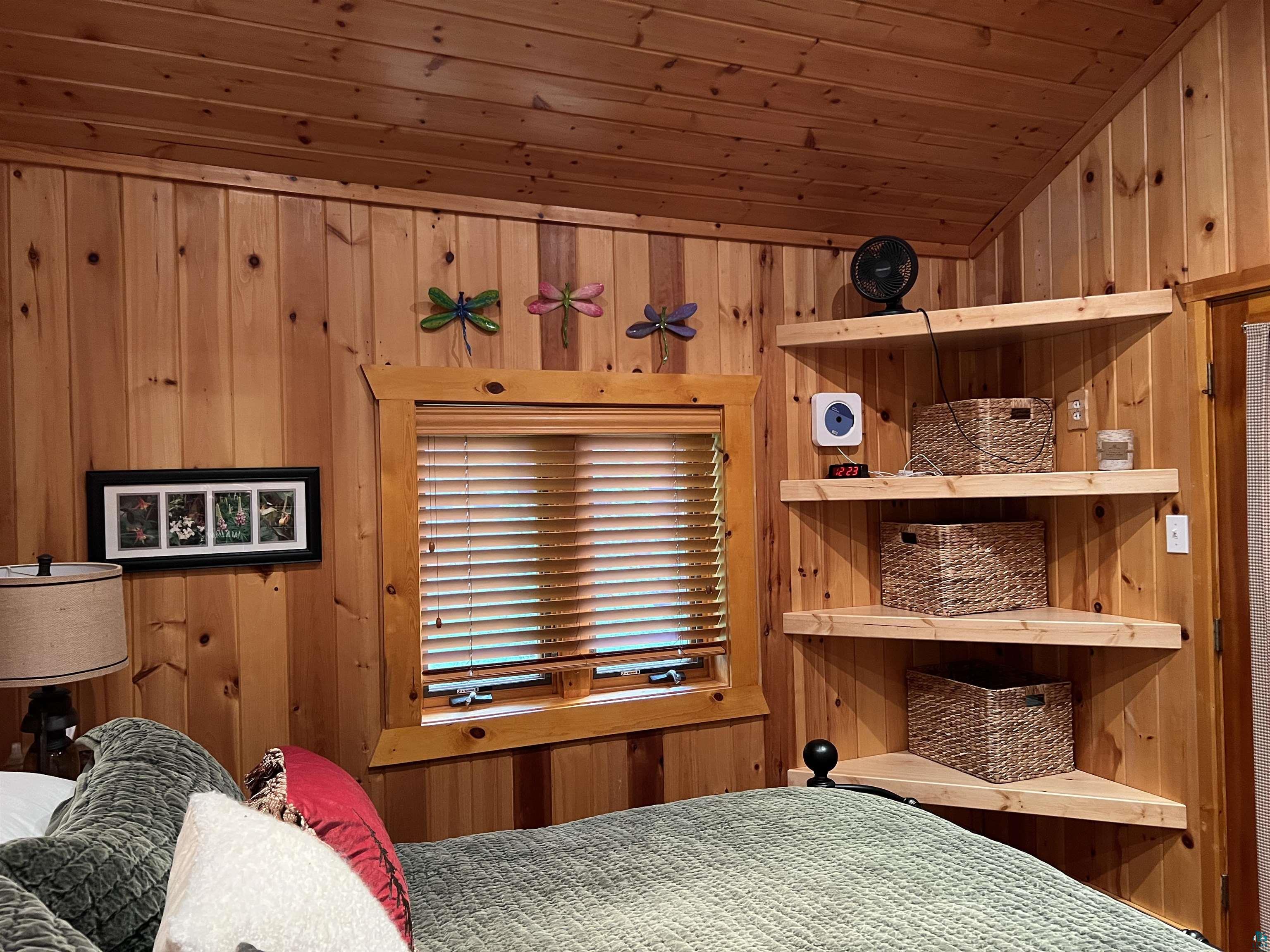 46835 Behan Drive Cable, WI 54821 - Photo 19 of 42 Bedroom featuring wooden ceiling and wood walls