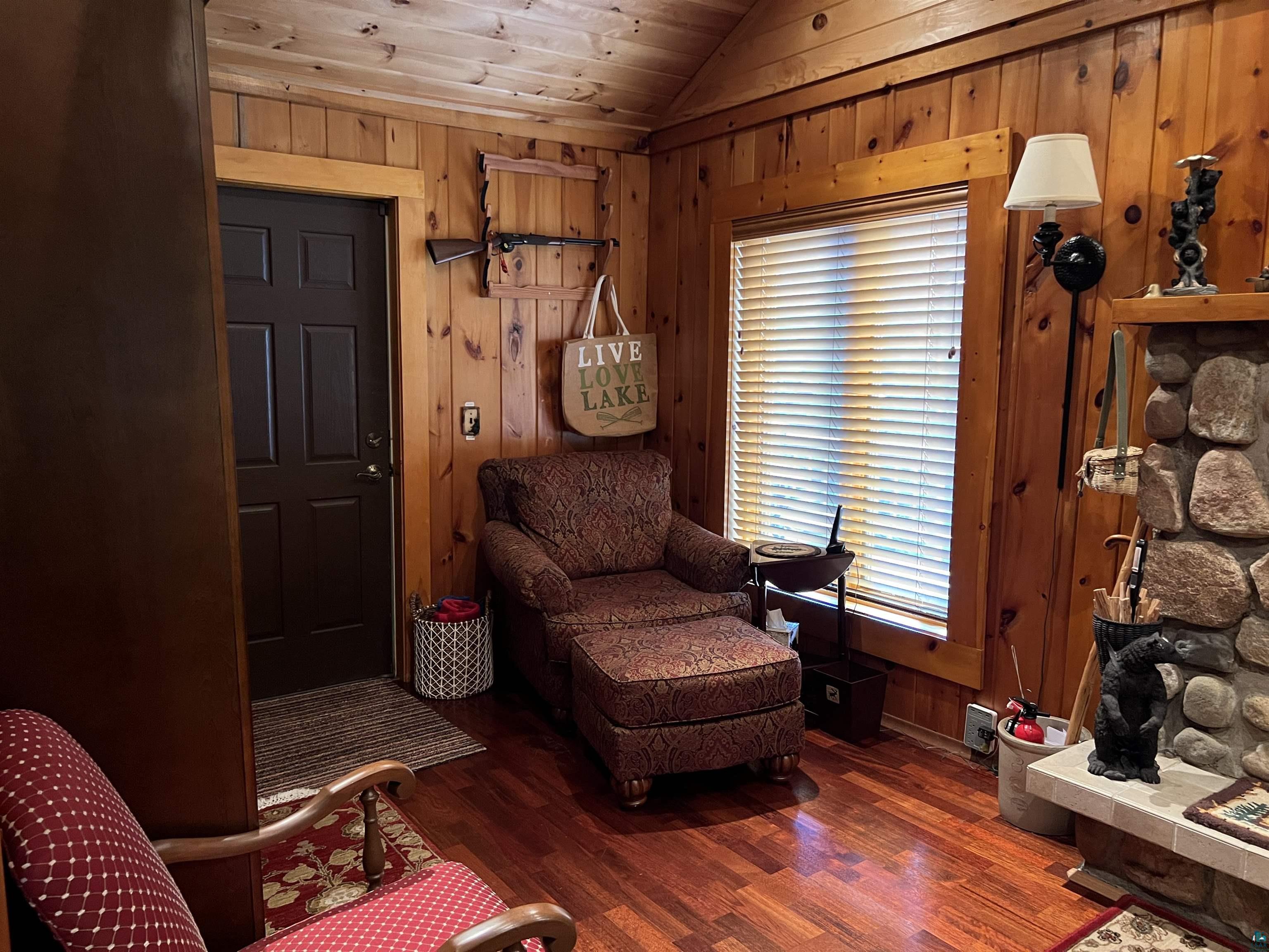 46835 Behan Drive Cable, WI 54821 - Photo 23 of 42 Sitting room featuring wooden ceiling, wood walls, dark wood-type flooring, and lofted ceiling