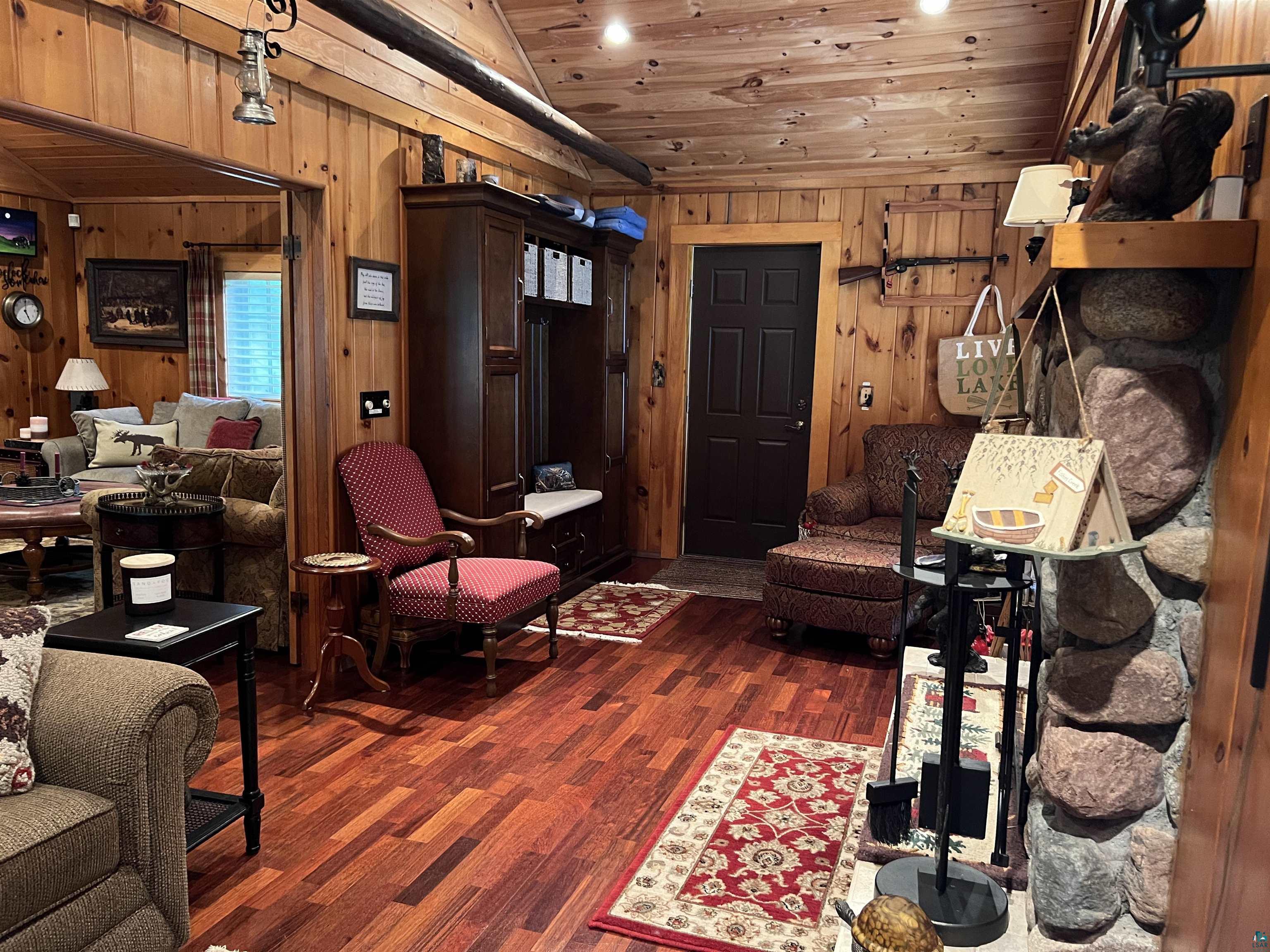46835 Behan Drive Cable, WI 54821 - Photo 24 of 42 Living room with wood ceiling, wooden walls, and dark wood-type flooring