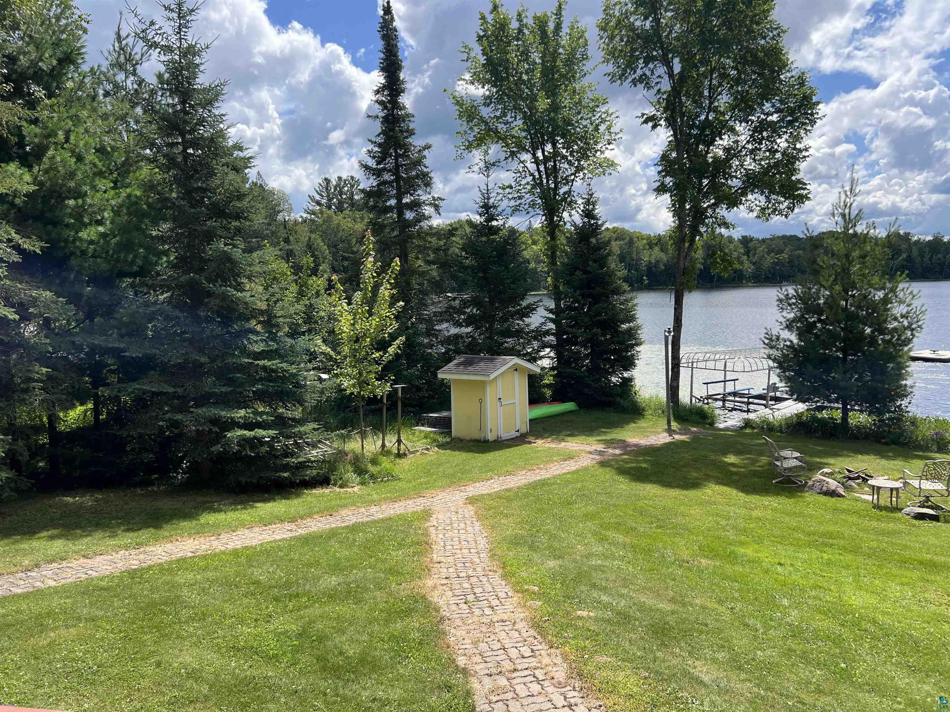 46835 Behan Drive Cable, WI 54821 - Photo 29 of 42 View of yard featuring a water view and a storage shed