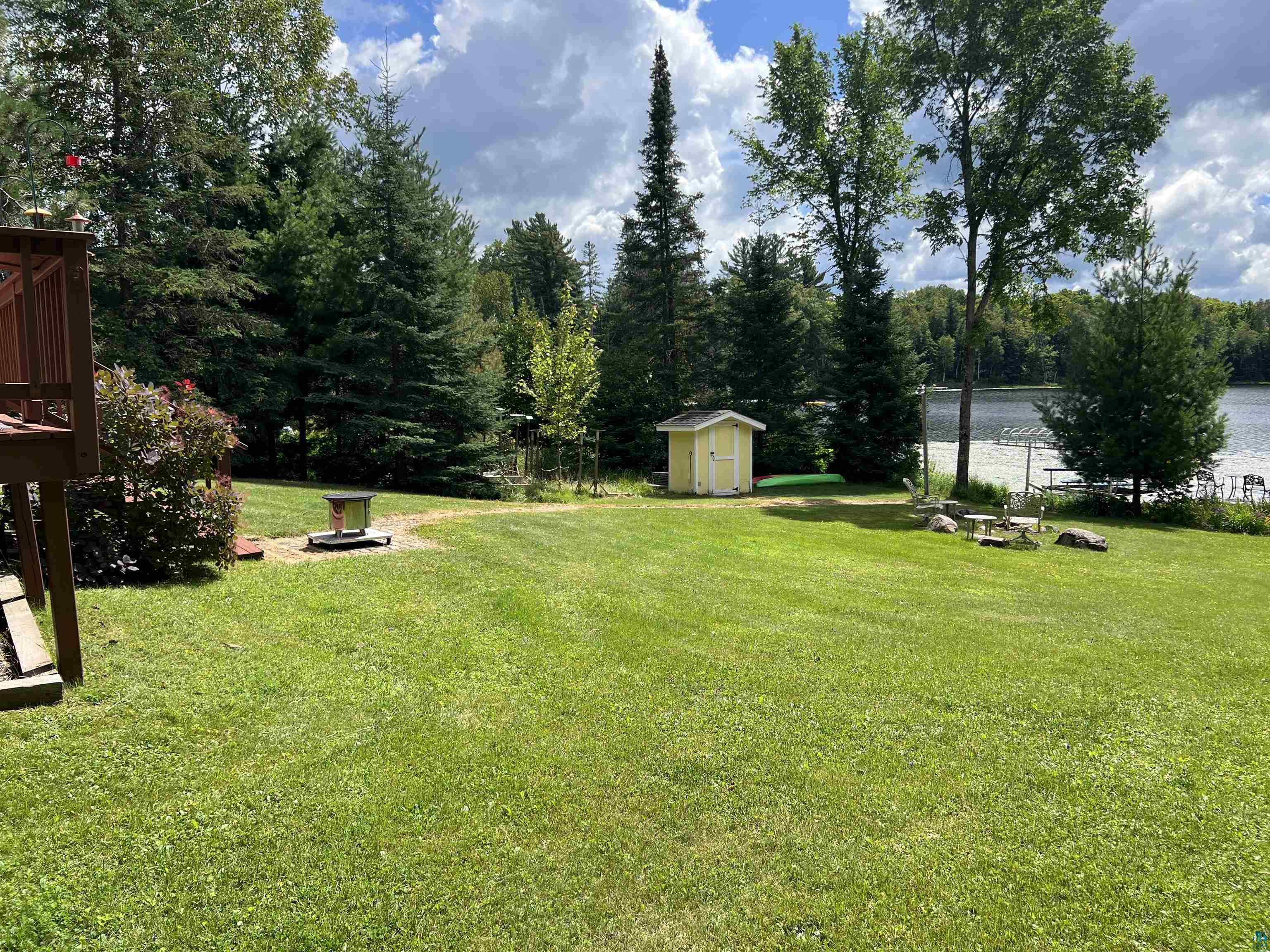 46835 Behan Drive Cable, WI 54821 - Photo 30 of 42 View of yard featuring a shed and a water view