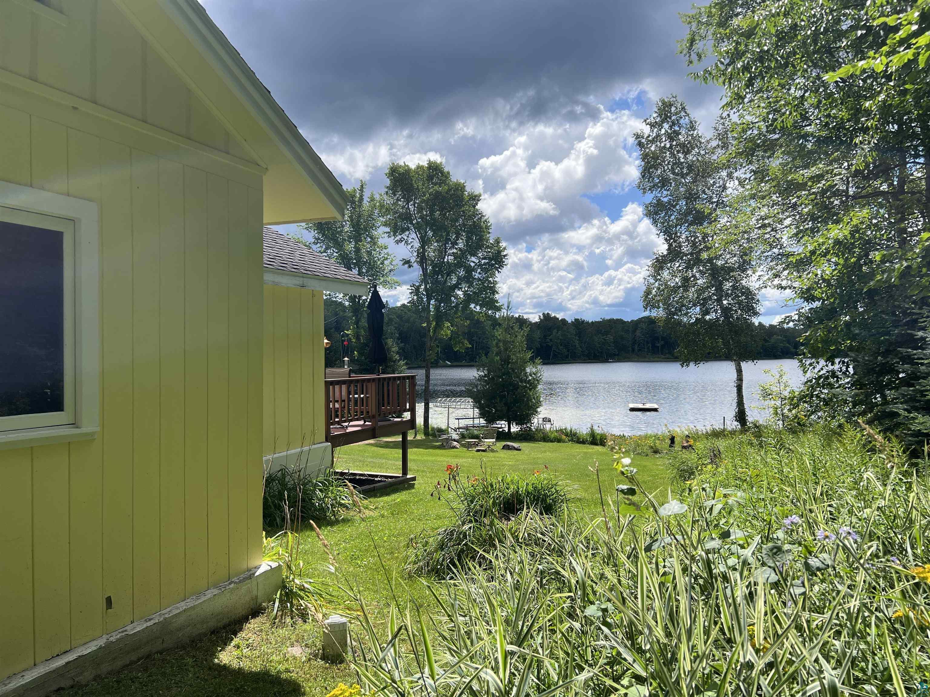 46835 Behan Drive Cable, WI 54821 - Photo 6 of 42 View of yard with a deck with water view