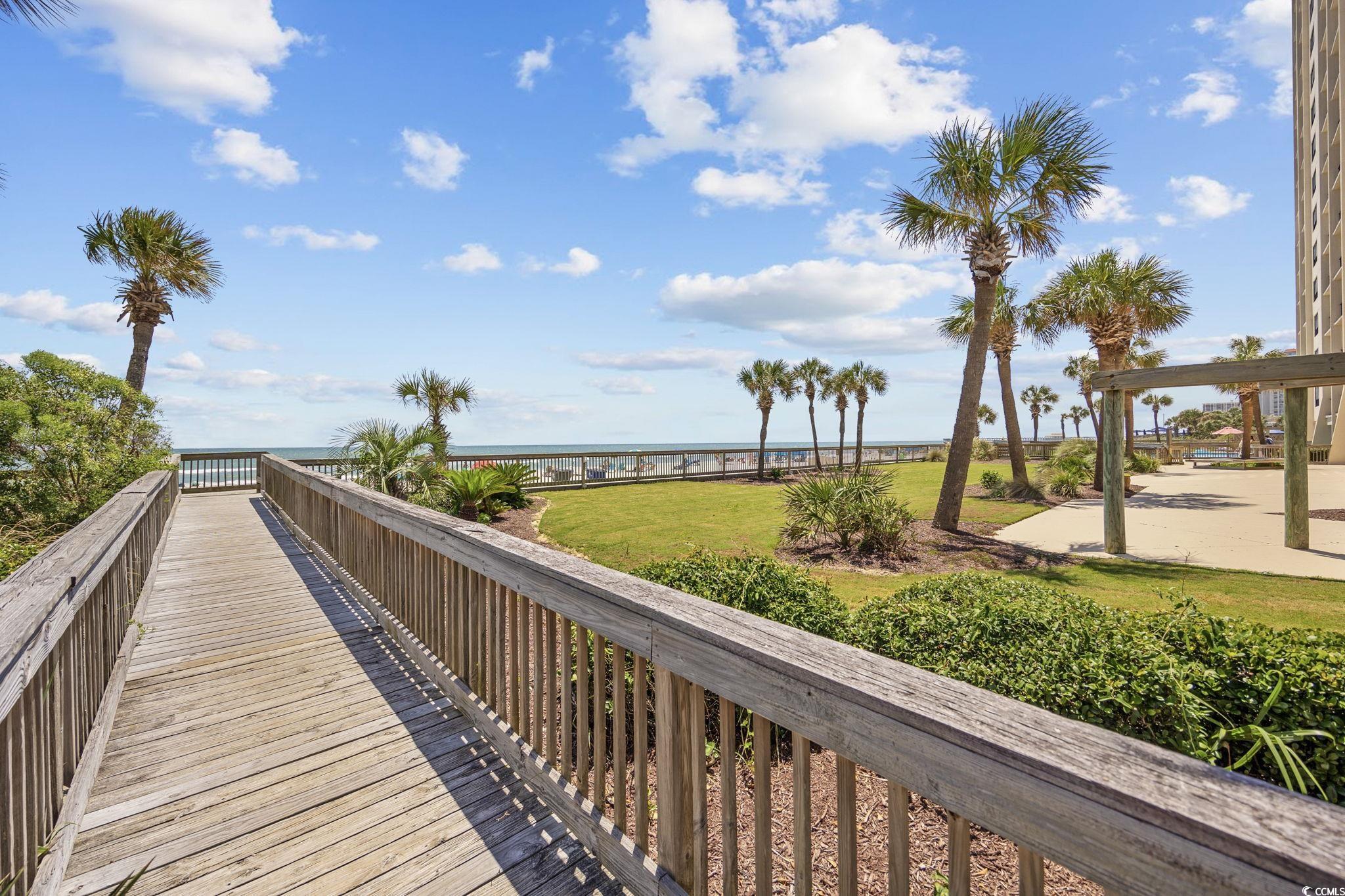 10100 Beach Club Drive, Unit 14F Myrtle Beach, SC 29572 - Photo 30 of 40 View of community featuring a water view and a yard