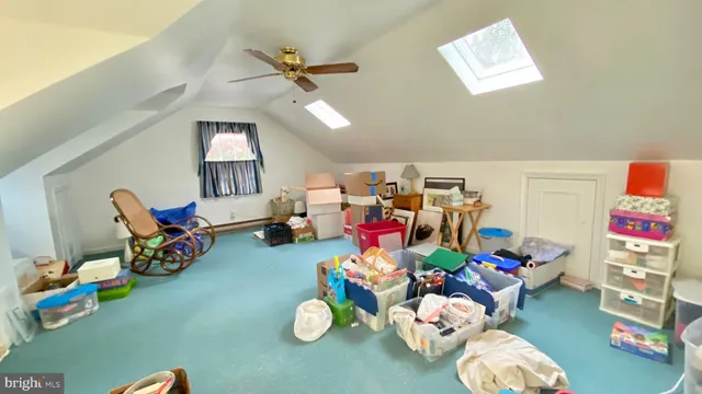 a playing room with toys and a wooden floor