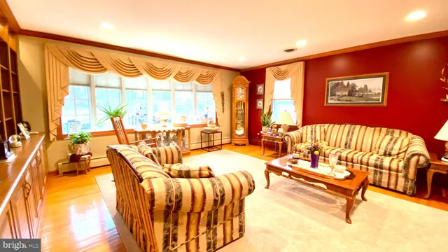 a view of a living room with a balcony furniture and floor to ceiling window