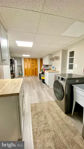 a kitchen with a sink a counter space and appliances
