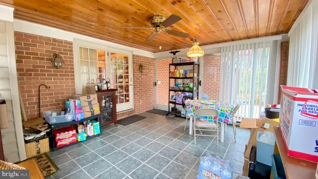 a view of play room with windows and air conditioner