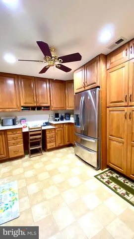 a kitchen with stainless steel appliances granite countertop a refrigerator oven a sink and dishwasher