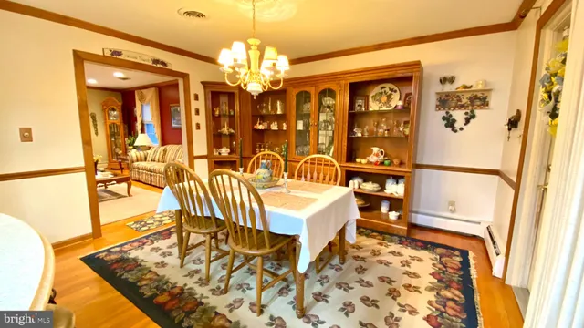 a living room with a couch and a chandelier