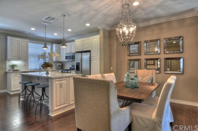 4 Arlington Street Ladera Ranch, CA 92694 - Photo 1 of 1 Completely remodeled kitchen and dining room complete with white cabinetry, new lighting, Carerra Marble countertops, white subway tile backsplash, and stainless steel appliances.