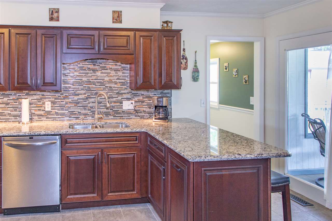 14 Thacker Mill Road Verona, VA 24482 - Photo 12 of 47 a kitchen with stainless steel appliances granite countertop wooden cabinets and a sink