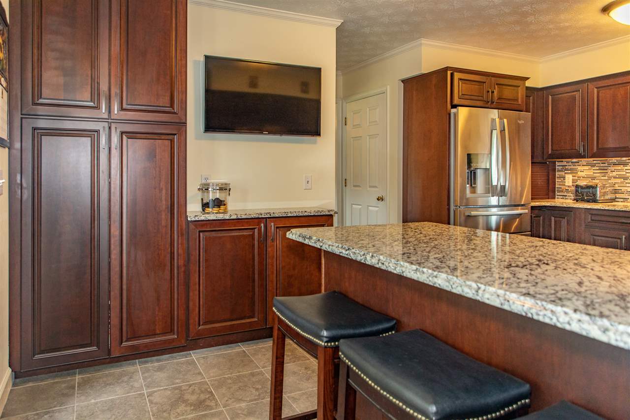 14 Thacker Mill Road Verona, VA 24482 - Photo 13 of 47 a kitchen with stainless steel appliances granite countertop a sink and a refrigerator