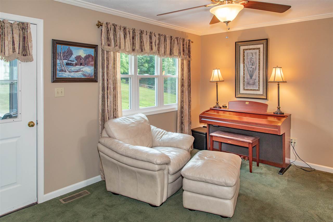14 Thacker Mill Road Verona, VA 24482 - Photo 17 of 47 a living room with furniture and a window