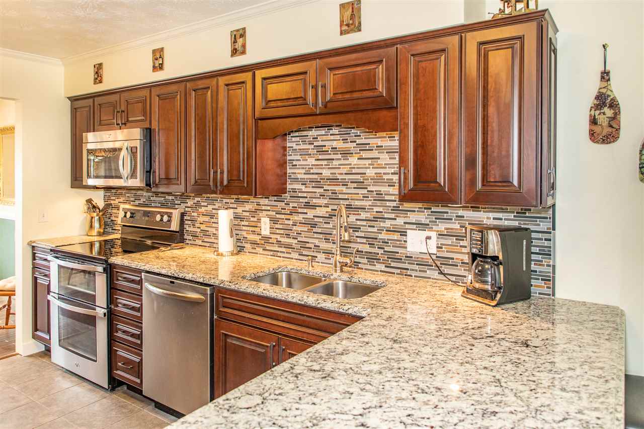 14 Thacker Mill Road Verona, VA 24482 - Photo 3 of 47 a kitchen with stainless steel appliances granite countertop a sink and cabinets