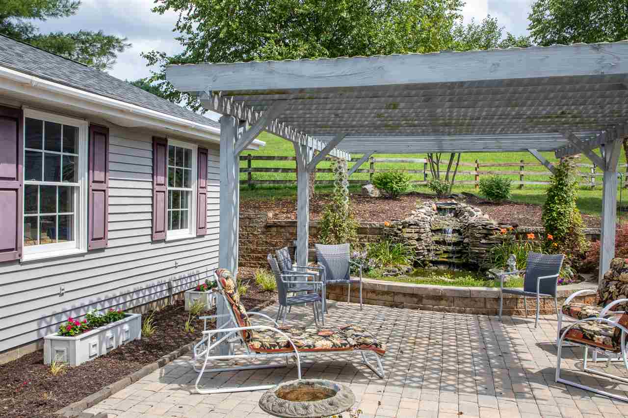 14 Thacker Mill Road Verona, VA 24482 - Photo 38 of 47 a patio with table and chairs and potted plants
