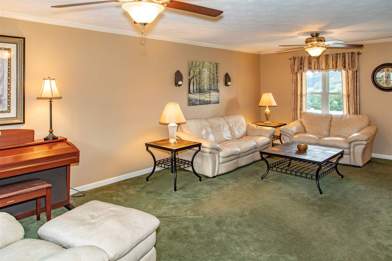 14 Thacker Mill Road Verona, VA 24482 - Photo 4 of 47 a living room with furniture a lamp and a window