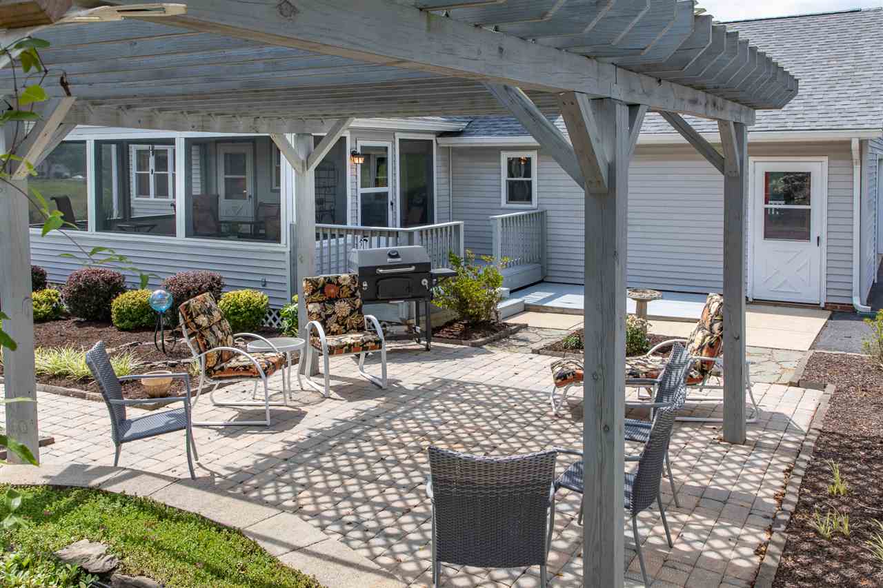 14 Thacker Mill Road Verona, VA 24482 - Photo 47 of 47 a view of a patio with table and chairs potted plants and floor to ceiling window